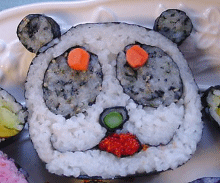 The panda's nose is asparagus and the mouth is tobiko.