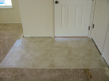 Entryway.  You can see the angle that will be cut later where the carpet meets.