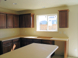 Cabinets over the kitchen sink.