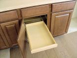 One of the sliding shelves in the cabinets.