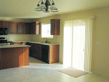 Final picture of the kitchen with vertical blinds.