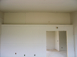 The master bedroom from the other end looking at the plant shelf.