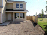 Fence wing on the northwest side of the house.