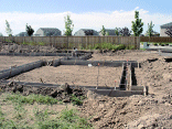 Closeup of the garage foundation. You can see into the form.
