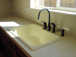 The composite sink and Tuscan bronze fixtures I chose in the kitchen.