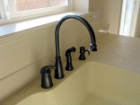 Closeup of the kitchen faucet.