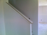 The cap and trim on the stairwell.