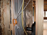 I went in and did some of my own wiring with a friend. This is surround sound wire behind the fireplace.
